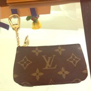 Louis Vuitton coin purse with attached keychain.